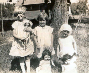 Mom's the little one on the right.  The other two are her older sisters.  Circa 1928.